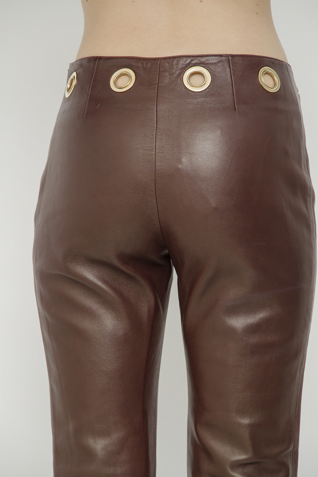 LEATHER GROMMET PANTS