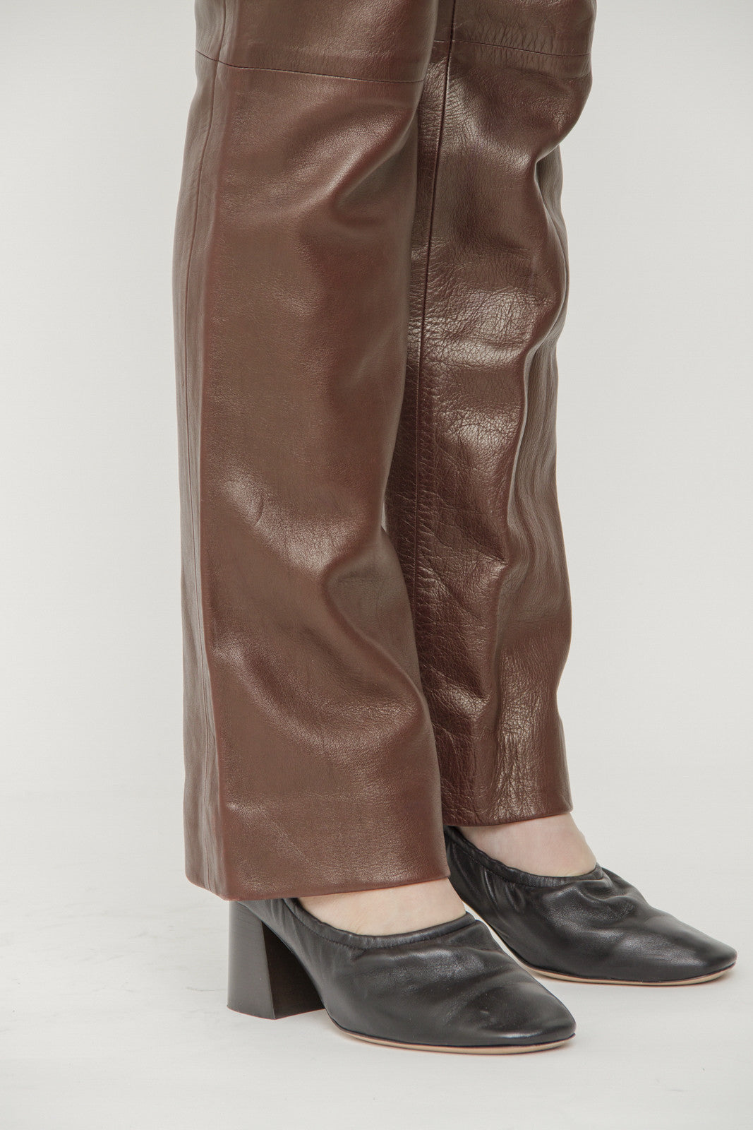 LEATHER GROMMET PANTS