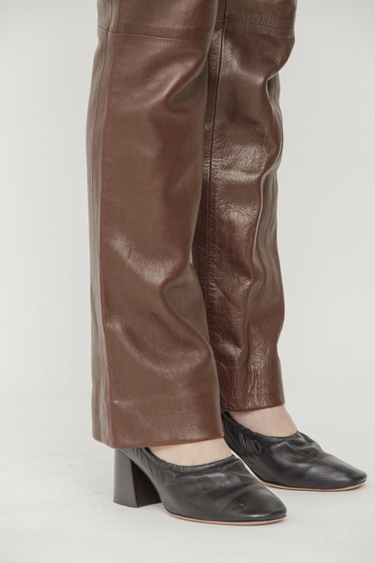 LEATHER GROMMET PANTS