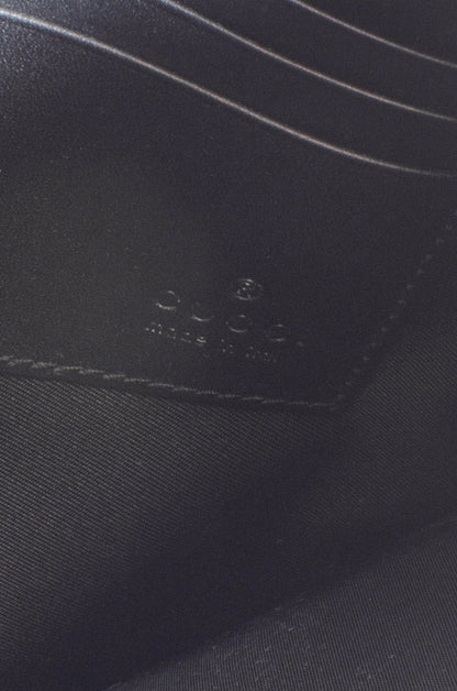 CALEIDO MONOGRAM CLUTCH